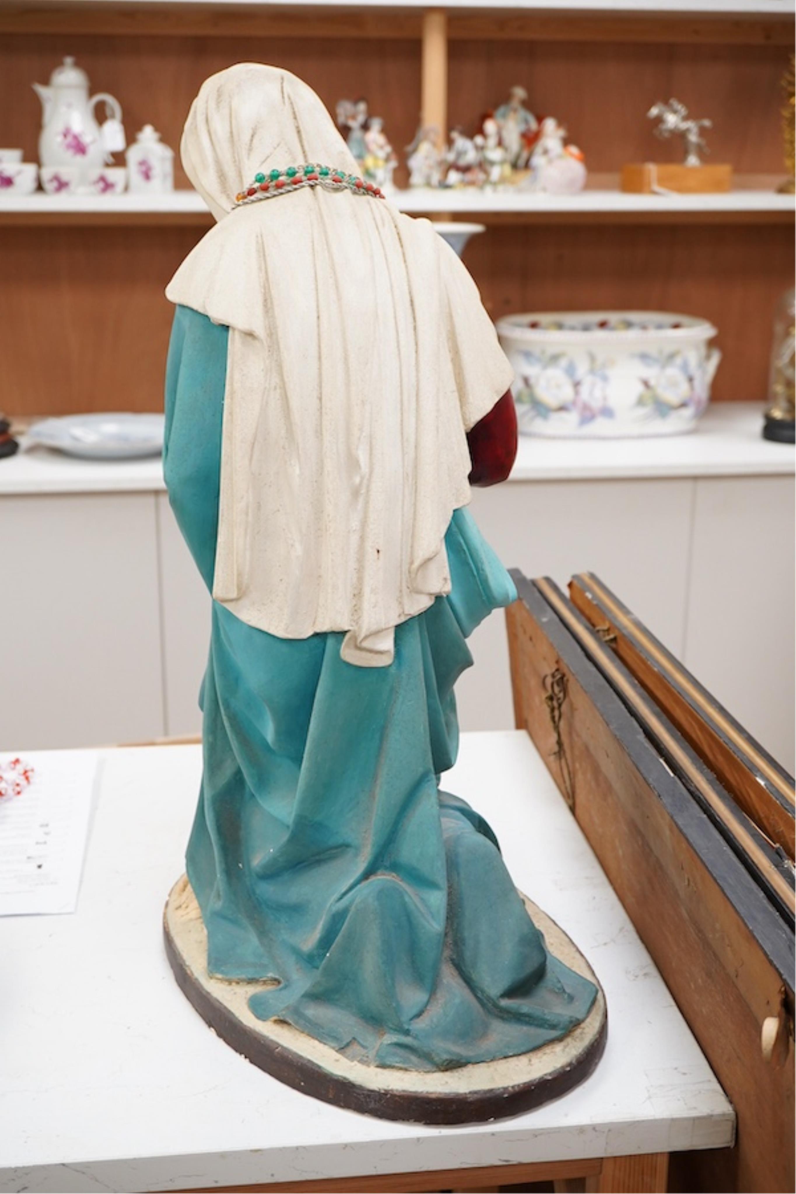 A plaster figure of Madonna at prayer, 61cm